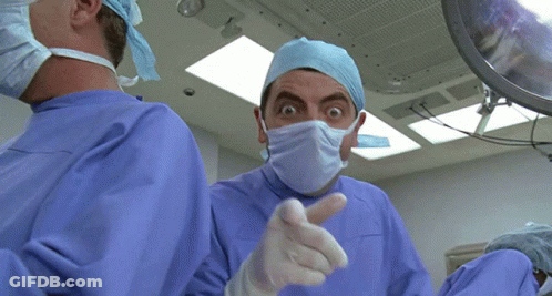 Surgeon Wearing Mask And Gloves GIF