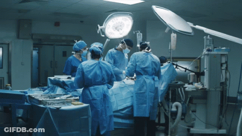 Surgeons Performing Surgery On Patient GIF