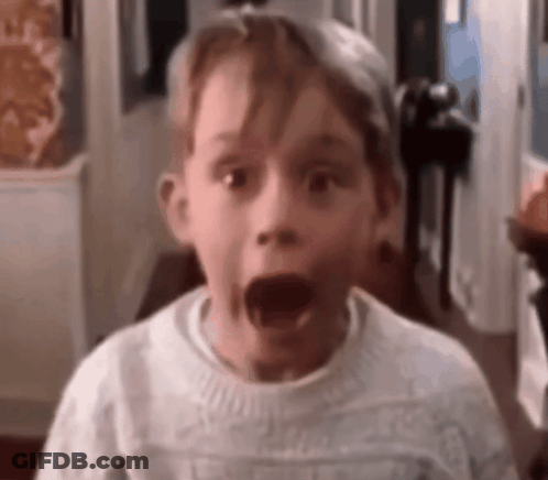 Surprised Boy In White Sweater GIF