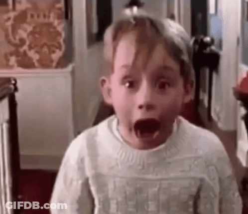 Surprised Boy In White Sweater GIF