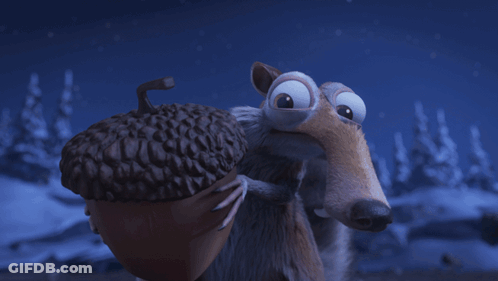 Surprised Cartoon Character Laying On Rock GIF