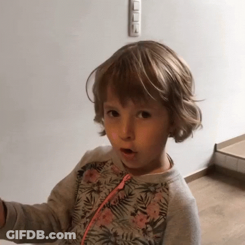 Surprised Little Girl In Floral Sweatshirt GIF