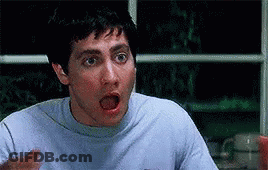 Surprised Man At Table GIF