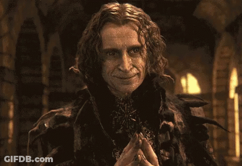 Surprised Man Holding Hands To Chest GIF