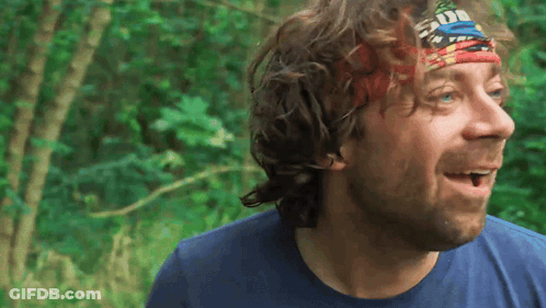 Surprised Man In Blue Shirt And Headband GIF
