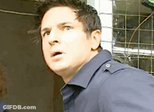 Surprised Man In Blue Shirt GIF