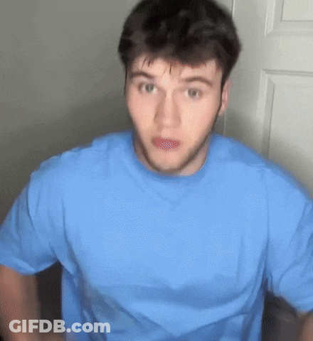 Surprised Man In Blue Shirt GIF