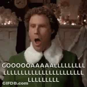Surprised Man In Green Elf Costume GIF