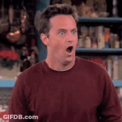 Surprised Man In Maroon Sweater GIF