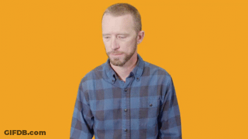 Surprised Man In Plaid Shirt Hands In Air GIF