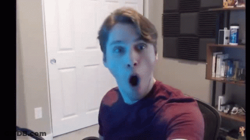 Surprised Man In Red Shirt GIF