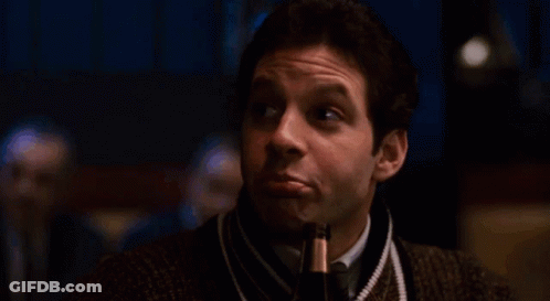 Surprised Man In Sweater And Tie GIF