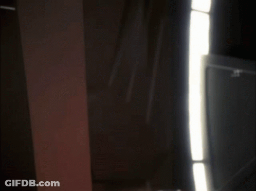 Surprised Man Peeking From Behind Wall GIF