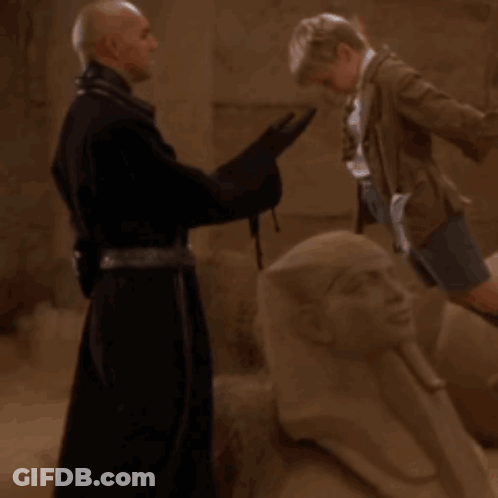 Surprised Man Speaking To Jar GIF