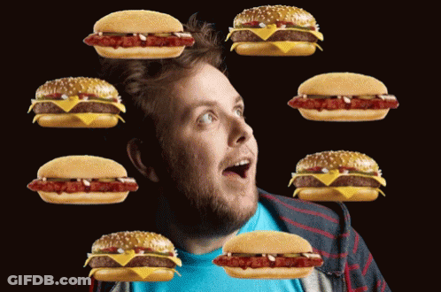 Surprised Man Surrounded By Hamburgers GIF