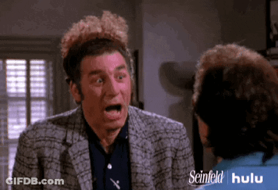 Surprised Man Talking To Woman In Seinfeld Hulu Ad GIF