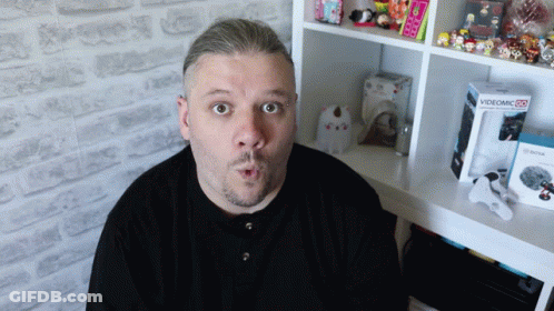 Surprised Man With Videomic 25 Box GIF