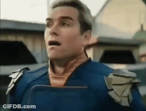 Surprised Superhero Man Holding Tablet GIF