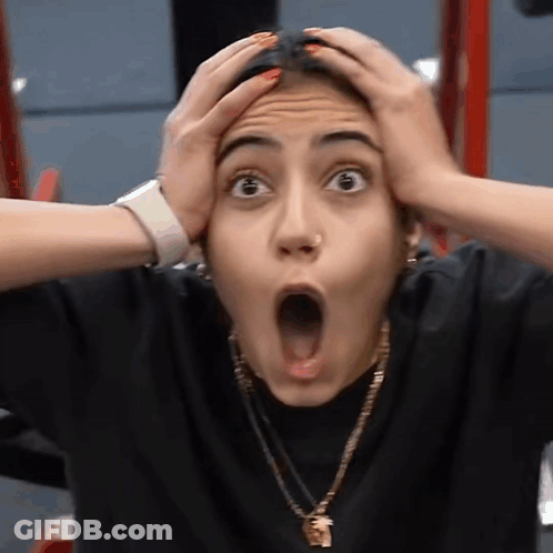 Surprised Woman Holding Head GIF