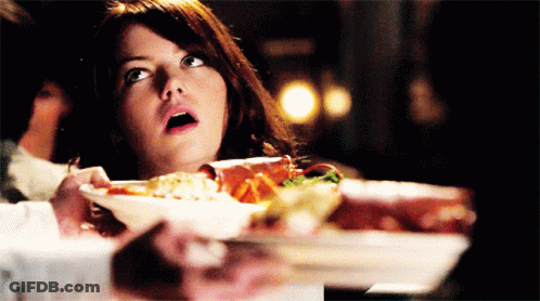Surprised Woman Holding Plate Of Food GIF