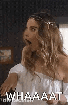 Surprised Woman In Off-Shoulder Top And Headband GIF