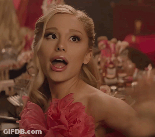 Surprised Woman In Pink Dress With Flower GIF