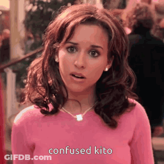 Surprised Woman In Pink Sweater And Necklace GIF