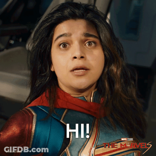 Surprised Woman In Superhero Costume Saying Hi GIF