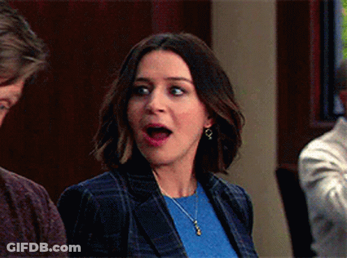 Surprised Woman Next To Man GIF