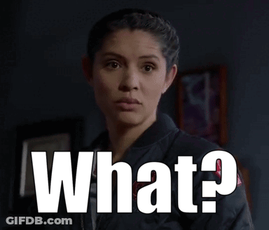 Surprised Woman Standing Before What Sign GIF