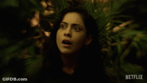 Surprised Woman Surrounded By Greenery And Netflix Logo GIF