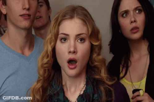 Surprised Woman Surrounded By People GIF