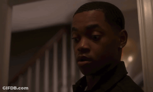 Surprised Young Man In Front Of Staircase GIF