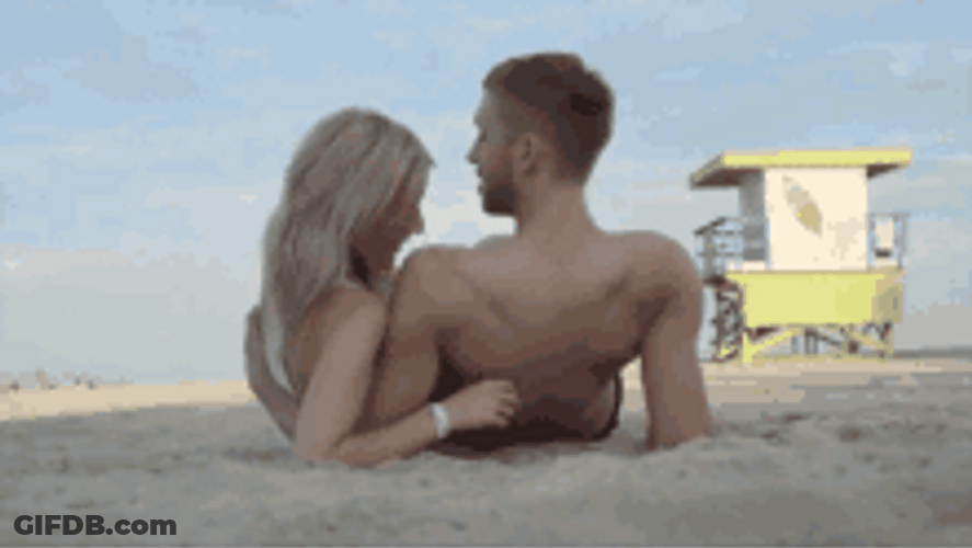 Sweet Couple Enjoying Beach Getaway GIF