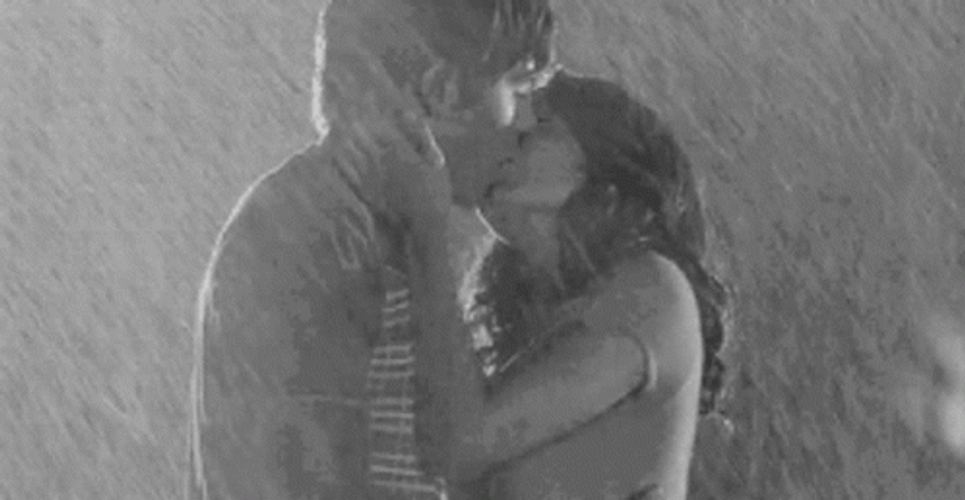 Sweet Couple Kissing In Monsoon Rain GIF