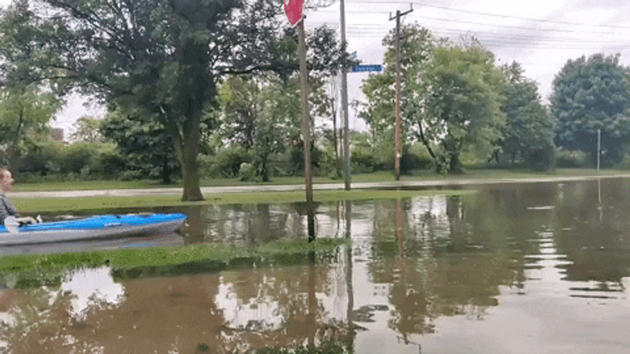 Sweet Lady Riding Boat In Monsoon Flood GIF