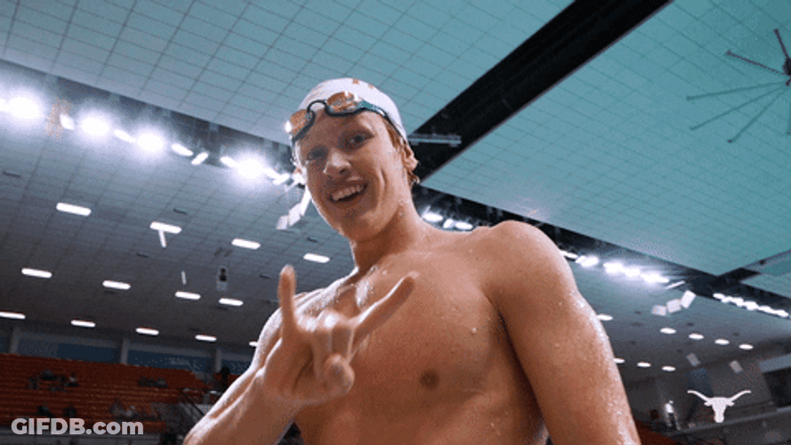 Swimmer Doing Hook Em Sign GIF