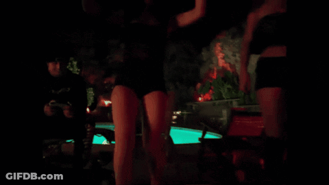 Swimming Pool At Night With Green Lights GIF