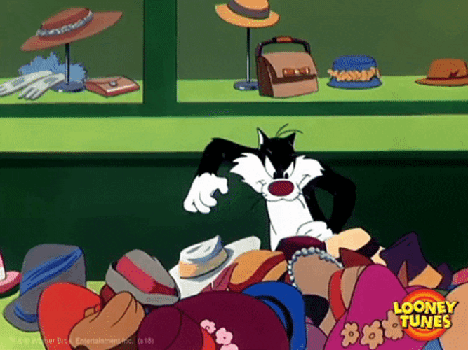 Sylvester Scrambling Through Black Friday Bargain Hats GIF