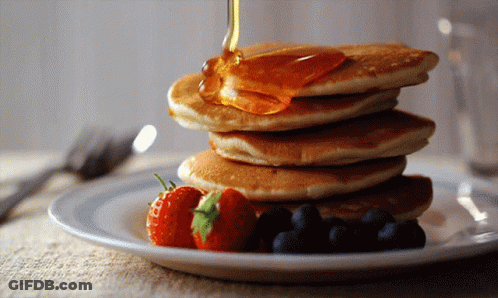 Syrup Poured On Pancakes With Strawberries And Blueberries GIF