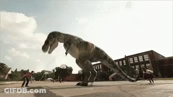 T-Rex Jumping Over Skateboarders In Parking Lot GIF