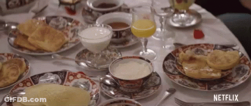 Table With Food Drinks And Netflix Logo GIF
