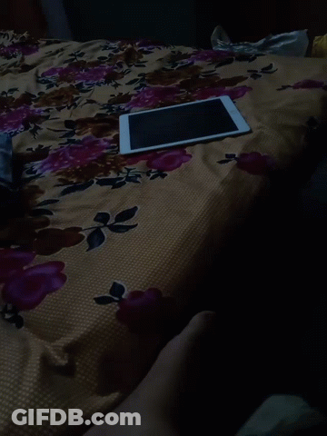 Tablet Laying On Floral Bed GIF
