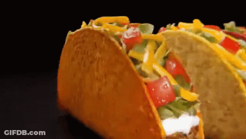 Taco With Tomatoes Cheese Lettuce Sour Cream GIF