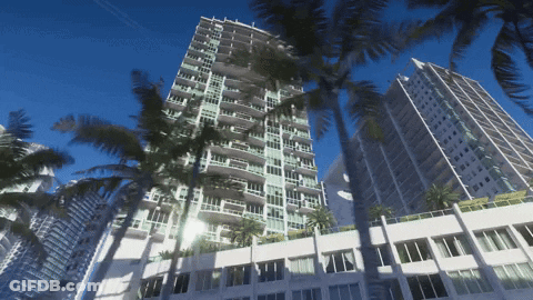 Tall Building With Palm Trees And Windows GIF