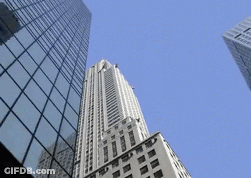 Tall Building With Simple Sign GIF