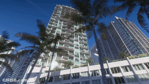 Tall Building With Windows And Palm Trees GIF