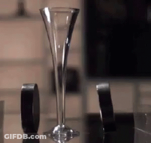 Tall Glass Beside Black Tape GIF