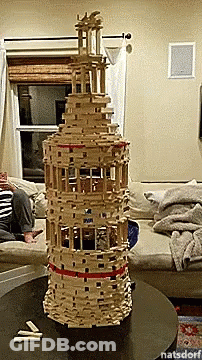 Tall Wooden Block Tower On Table GIF