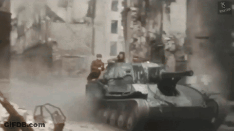 Tank Driving Through City Street GIF